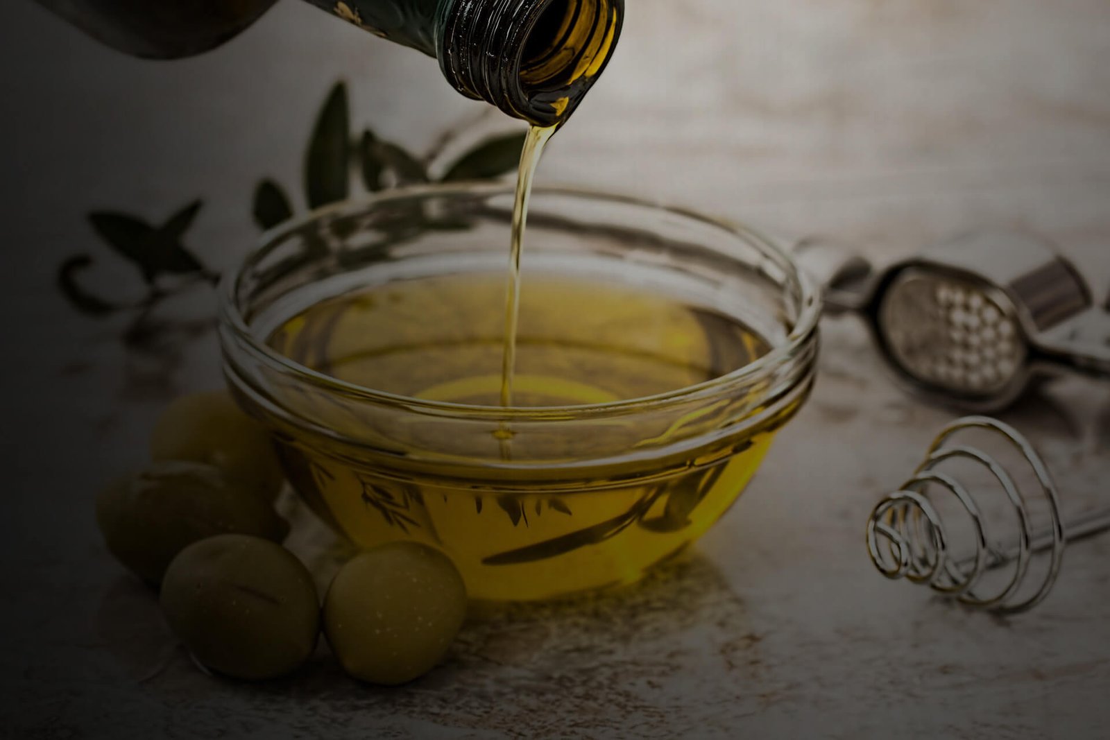 Olive oil being poured into bowl